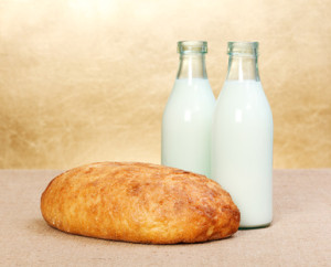 Whole bread and two milk bottles